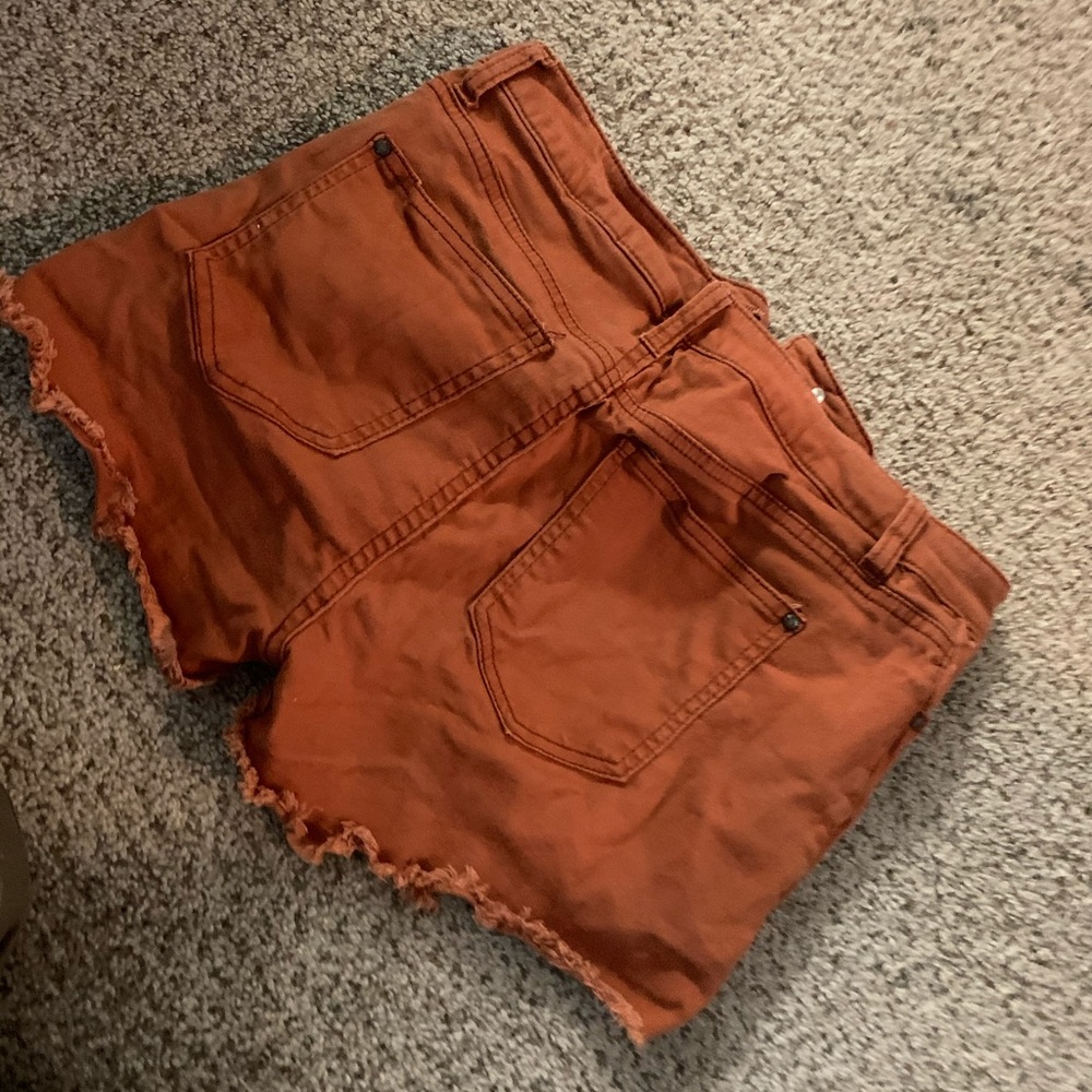 Orange ripped shorts